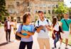 Cornell Scandal Ignites NATIONWIDE Fight College students walking on campus with books and backpacks